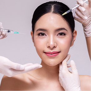 Girl surrounded by two doctors with syringes